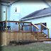 Brown Treated Lumber Deck with Black Galvium Balasters